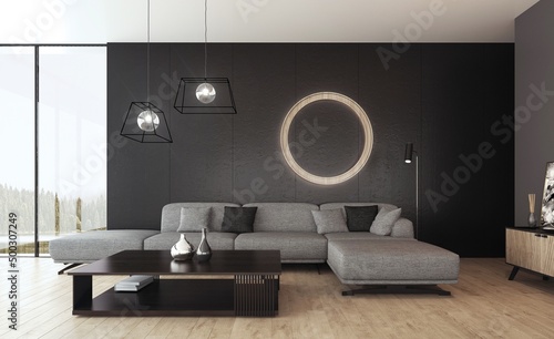 Wnętrze pokoju dziennego z szarą sofą przed czarną ścianą i okrągłą lampą ozdobną.