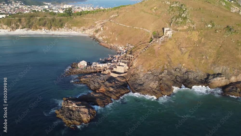 Small and simple fishing village in a wonderful paradise beach with turquoise blue water in the atlantic ocean - Arraial do Cabo, Rio de Janeiro Small and simple fishing village in a wonderful paradise beach with turquoise blue water in the atlantic ocean - Arraial do Cabo, Rio de Janeiro