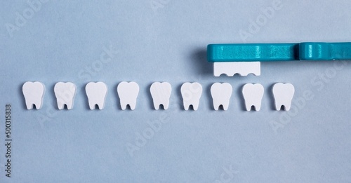 Teeth row with brush. Dental care, protection and prevention of caries, periodontal diseases. Professional cleaning and whitening. Kids toys. High quality photo