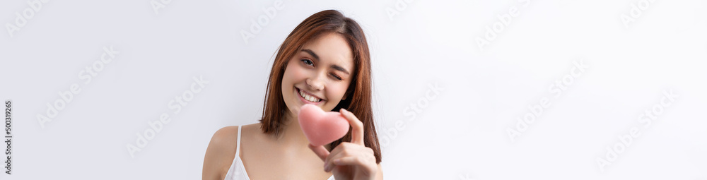 Beautiful smiling woman with clean skin, natural make-up and white teeth on a gray background Beautiful smiling woman with clean skin, natural make-up and white teeth on a gray background