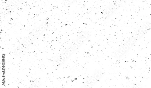 Small uneven spots and particles of debris. Abstract vector texture. Distressed uneven background. Grunge texture overlay with fine grains isolated on white background. Vector illustration. EPS10.