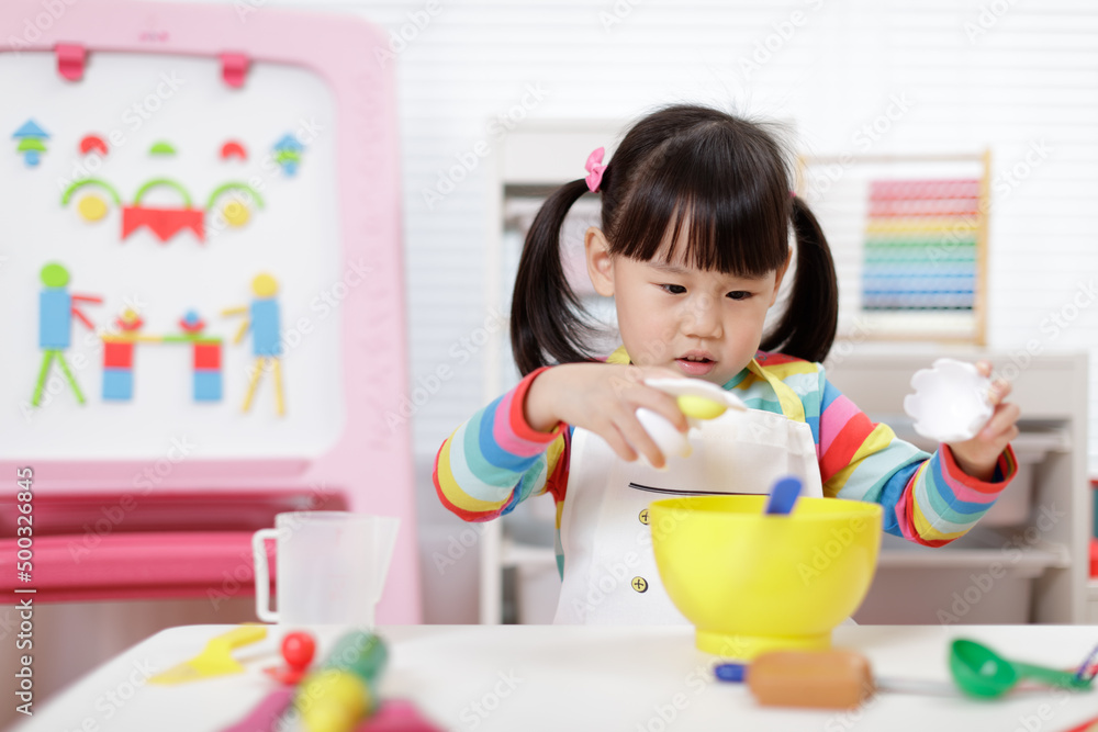 young girl pretend playing food preparing at home young girl pretend playing food preparing at home
