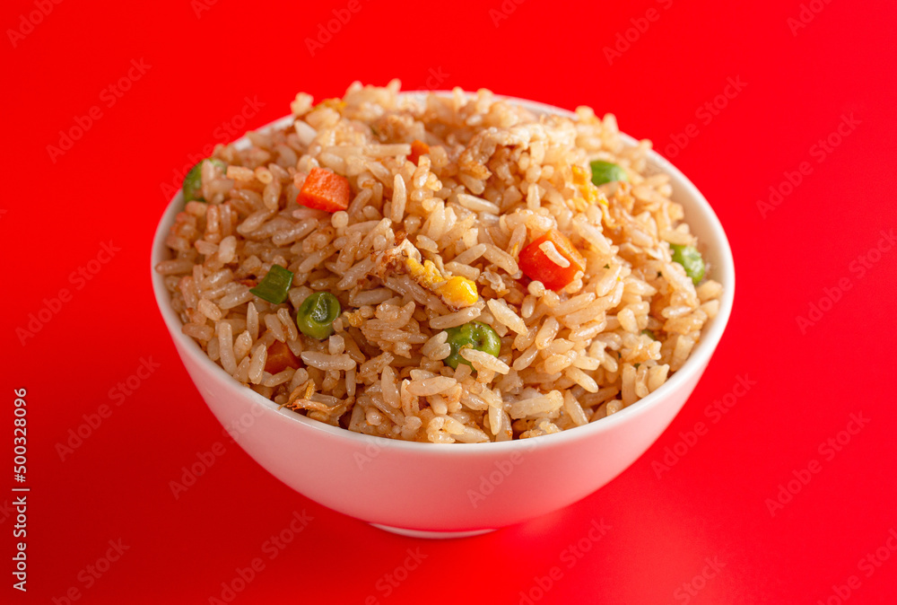 Bowl of Fried Rice on a Red Background Bowl of Fried Rice on a Red Background