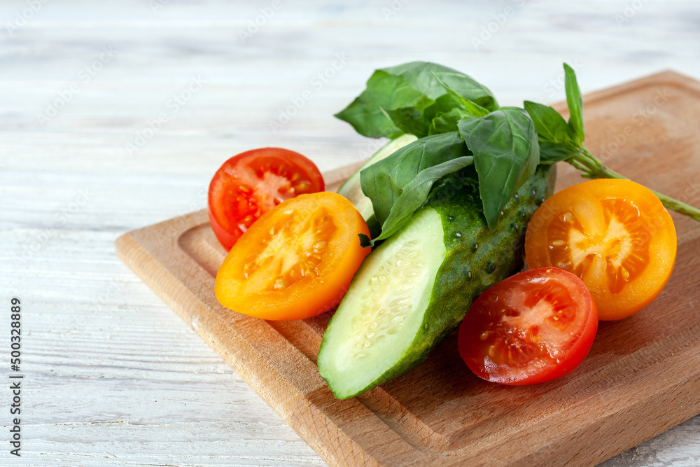 cucumber, yellow and red tomato and basil, healthy food concept, vegetable diet cucumber, yellow and red tomato and basil, healthy food concept, vegetable diet