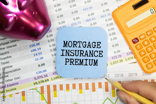 Mortgage Insurance Premium MIP with stack of documents. photo