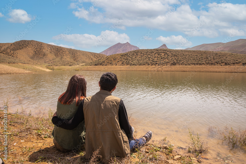 Couple sitting in the lake view