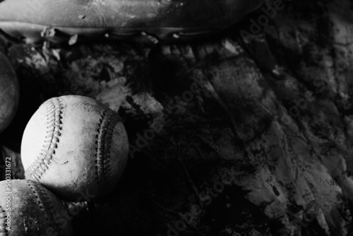 Old used baseball ball with copy space on dark background for sport.