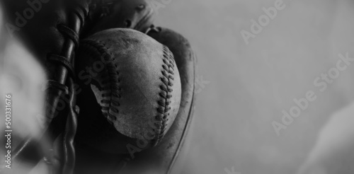Athletic team sport of baseball for banner background with vintage ball in glove closeup.
