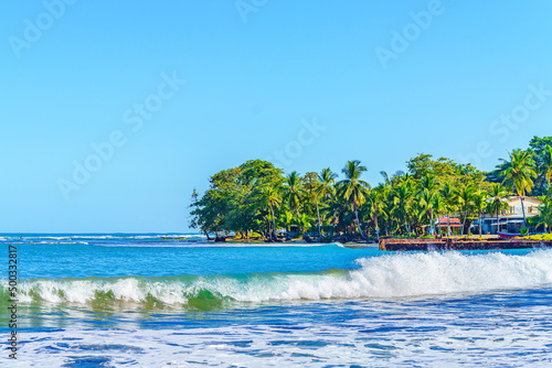 Playa Cocles, tropical beach with beautiful vegetation Caribbean beach, Puerto Viejo, Costa Rica east coast photo