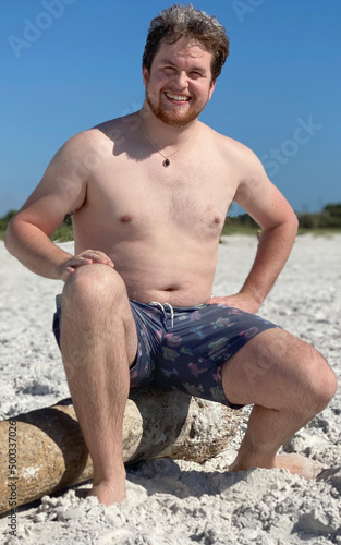 Man Sitting On Beach