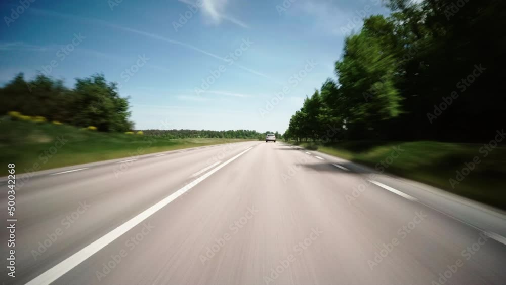 Point Of View Cars Moving On Road Amidst Green Landscape During Sunny Day - Stockholm, Sweden Point Of View Cars Moving On Road Amidst Green Landscape During Sunny Day - Stockholm, Sweden