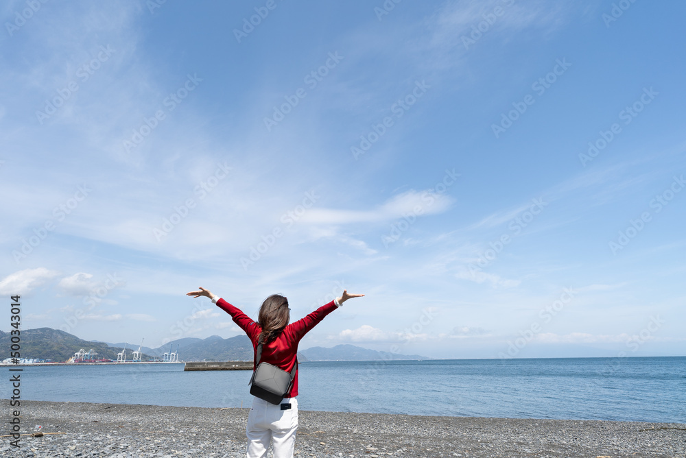woman breathing the fresh air in the shore woman breathing the fresh air in the shore