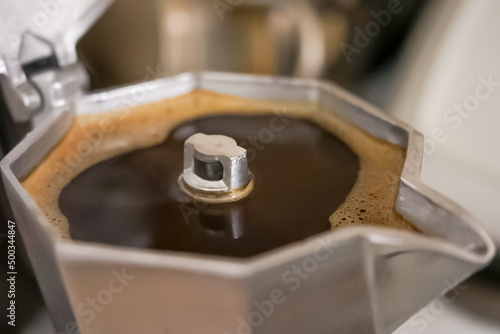 italian stove top coffee maker in use full