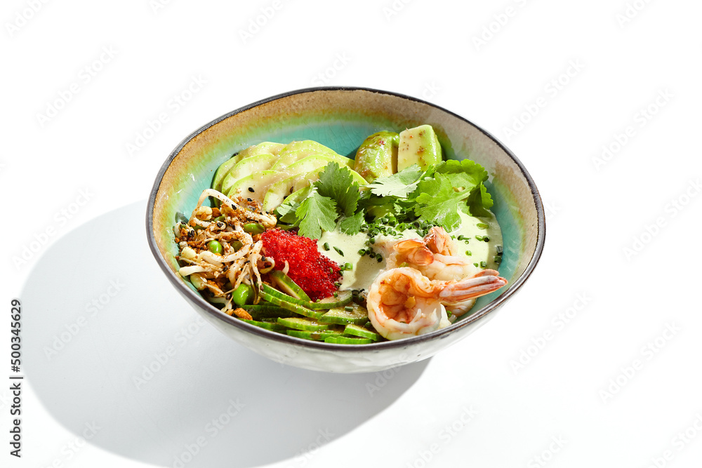 Healthy food - poke bowl with prawn, rice, fresh vegetables, edamame beans, soybean sprouts . Traditional dish Hawaiian cuisine. Poke bowl with shrimp isolated on white background. Dinner for slimming