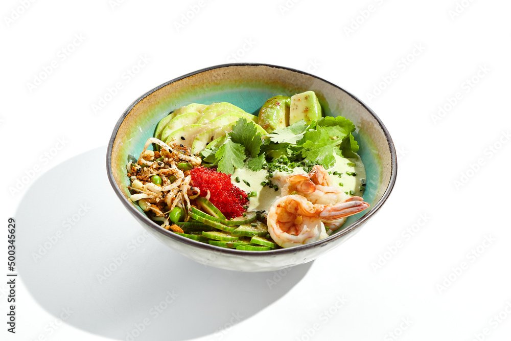 Healthy food - poke bowl with prawn, rice, fresh vegetables, edamame beans, soybean sprouts . Traditional dish Hawaiian cuisine. Poke bowl with shrimp isolated on white background. Dinner for slimming Healthy food - poke bowl with prawn, rice, fresh vegetables, edamame beans, soybean sprouts . Traditional dish Hawaiian cuisine. Poke bowl with shrimp isolated on white background. Dinner for slimming