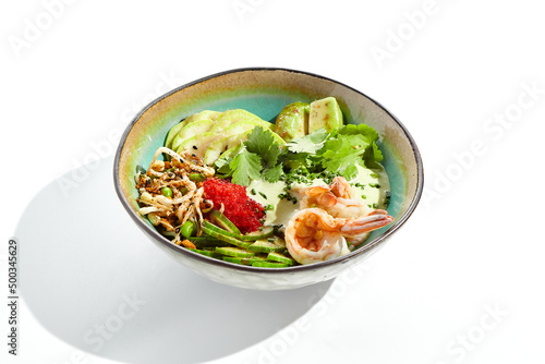 Healthy food - poke bowl with prawn, rice, fresh vegetables, edamame beans, soybean sprouts . Traditional dish Hawaiian cuisine. Poke bowl with shrimp isolated on white background. Dinner for slimming