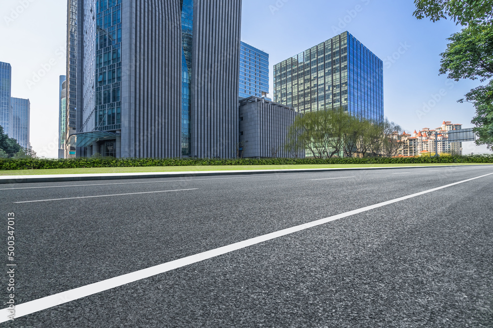 empty asphalt road front of modern buildings.