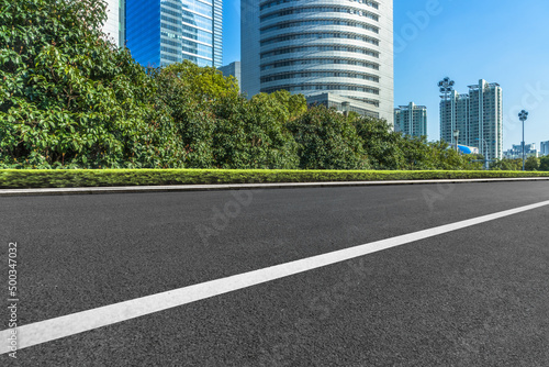 empty asphalt road front of modern buildings.