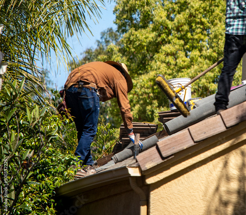 Roofer working on a residential roof