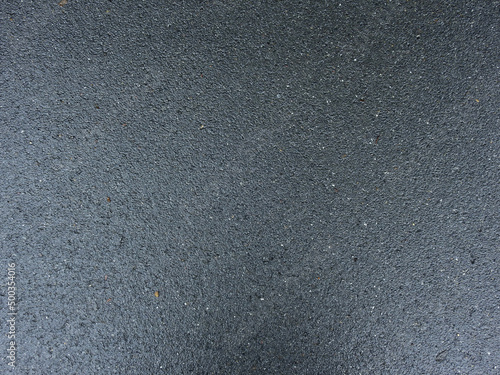 texture of wet asphalt road in street