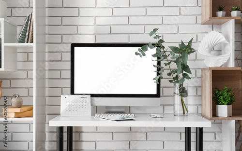 Workplace with computer, pl...