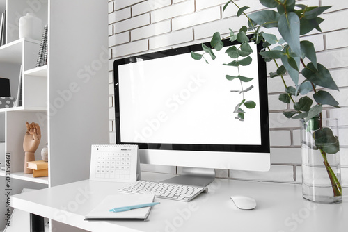 Workplace with computer, pl...