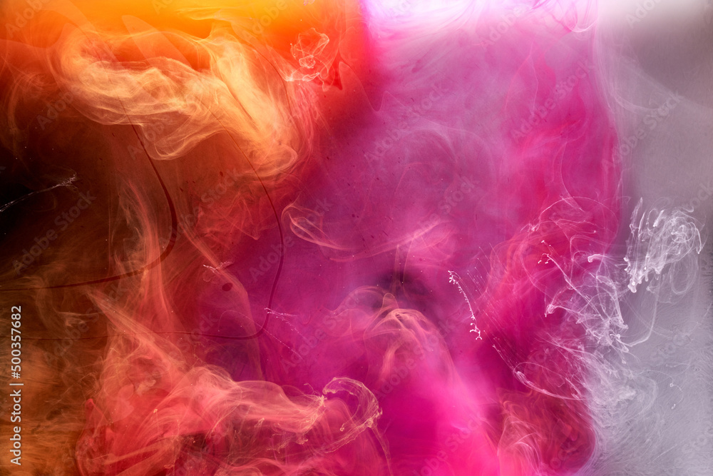 Orange pink smoke on black ink background, colorful fog, abstract swirling touch ocean sea, acrylic paint pigment underwater