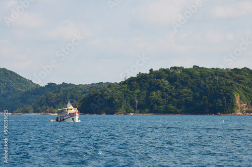 Ferry boat ship carry thai people foreign travelers and car vehicle crossing sea ocean Gulf of Thailand from Ao Thammachat Pier to Koh Chang island for travel visit on May 28, 2011 in Trat, Thailand