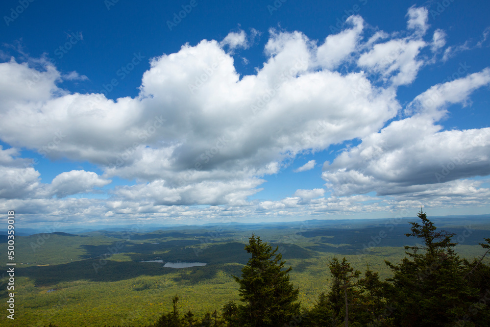 Cumulus clouds over the summit of Mount Kearsarge, New Hampshire.