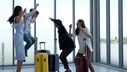 Young asian traveller with luggage in airport terminal fly together on vacation