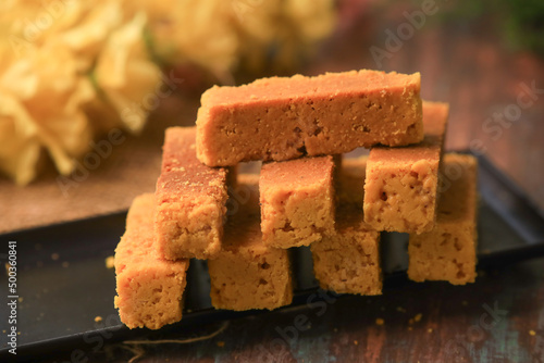 Mysorepak indian famous traditional sweet closeup with selective focus and blur photo