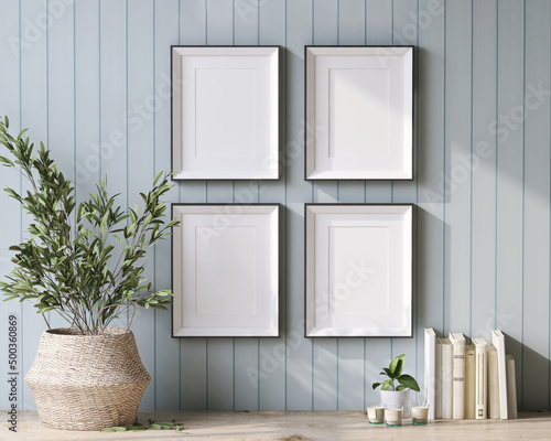 Fotobehang 3D render, a set of 4 blank wooden picture frame on cottage style wooden pastel blue panel wall with  decor houseplants in rattan basket, books and aroma candle light on the table