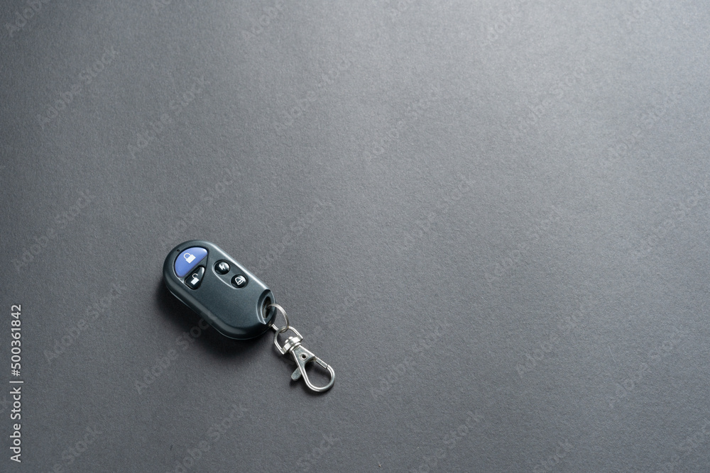 Smart motorcycle key on gray background. Vehicle alarm. Copy space. Smart motorcycle key on gray background. Vehicle alarm. Copy space.