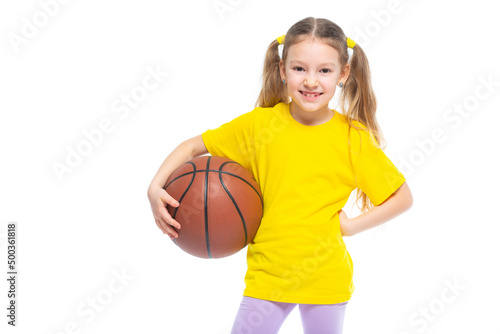 Little cute girl holding a basketball in her hand. Isolated on white background. © satyrenko