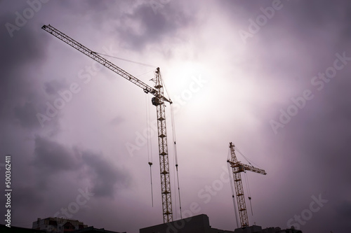 Crane and building construction site photo