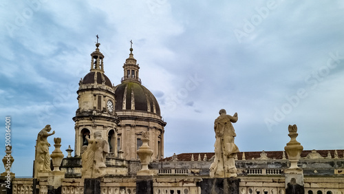 Scenic view from the central square on the Cathedral of Sant Agata, Piazza Duomo, Catania, Sicily, Italy. Close up view on religious sculpture. Cloudy overcast day in winter. Italian architecture