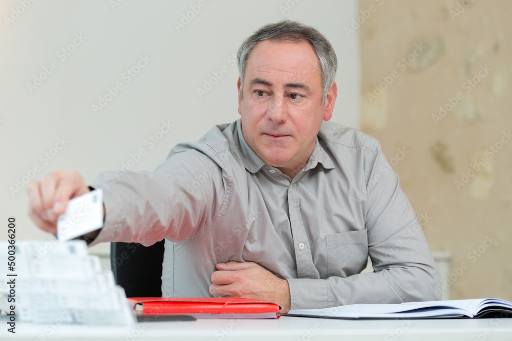 business giving his business card business giving his business card