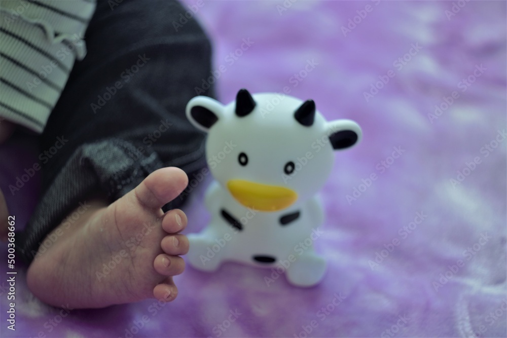 Naklejka premium baby foot and toy