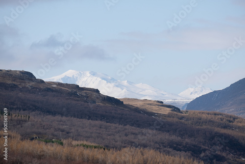 Snow capped summit glacier of King Snæfellsjökull Snaefells Volcano with beautiful nature landscape scenery on sunny day in Iceland photo