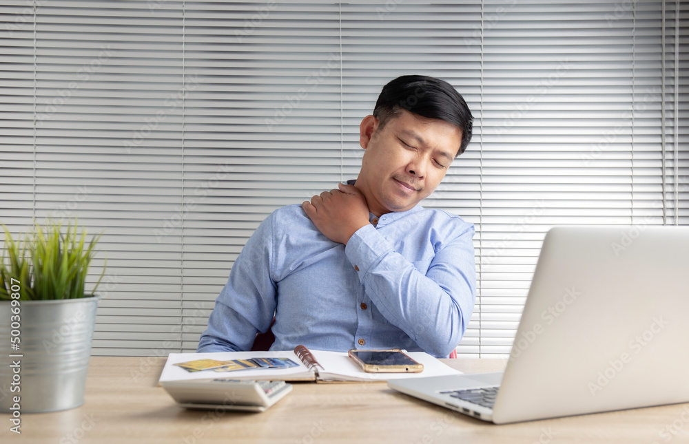 Asian business men are suffering from work-related pain from office syndrome. Asian business men are suffering from work-related pain from office syndrome.