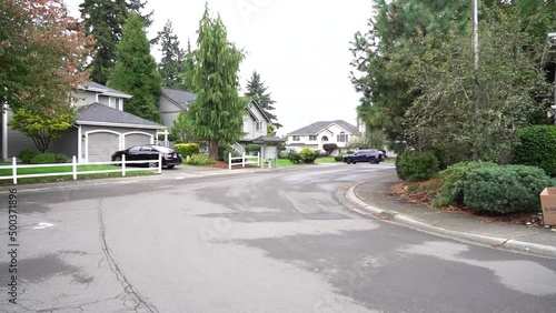 Posh neighborhood in seattle. Suburbs with wide streets and green gardens. photo