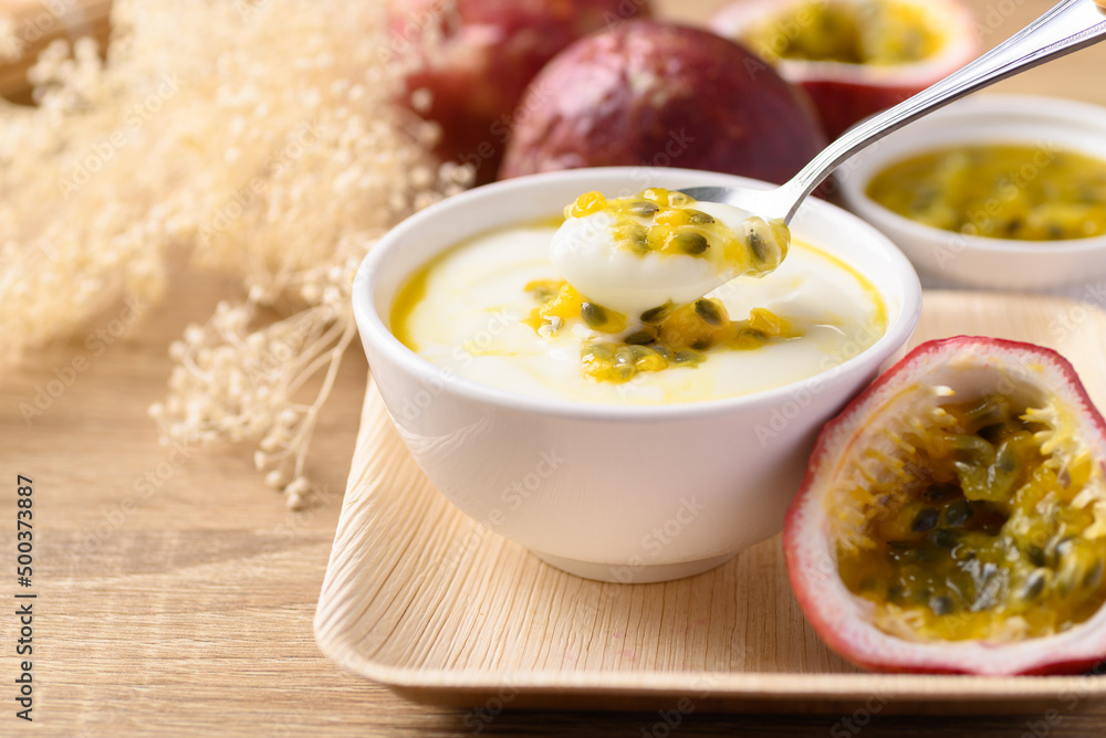 Yogurt with passion fruit in bowl, Healthy eating Yogurt with passion fruit in bowl, Healthy eating