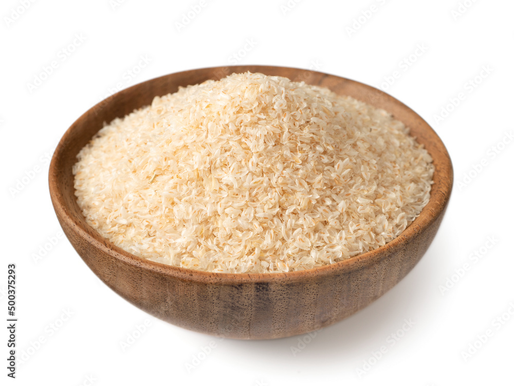 Psyllium husks in the wooden bowl, isolated on white background. Psyllium husks in the wooden bowl, isolated on white background.