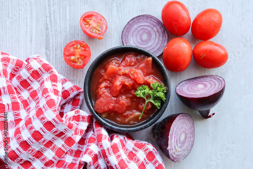 South African tomato and onion mix. Braai side dish. Tomato smoor photo