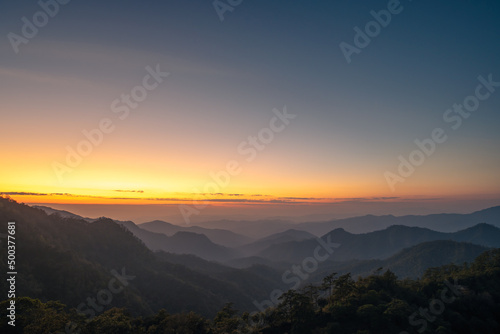 mountain background with colorful sky. rainforest in winter season with mountain range, pine tree in the jungle. stunning landscape in the world. south east Asia nature with national park. camping.