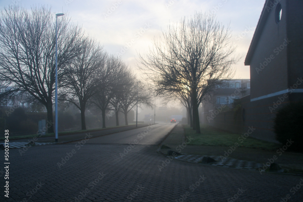 Misty streets and canals in an autumn Nieuwerkerk aan den IJssel Misty streets and canals in an autumn Nieuwerkerk aan den IJssel