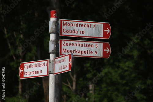 Red and white direction signs for cyclist in Nieuwerkerk aan den IJssel photo