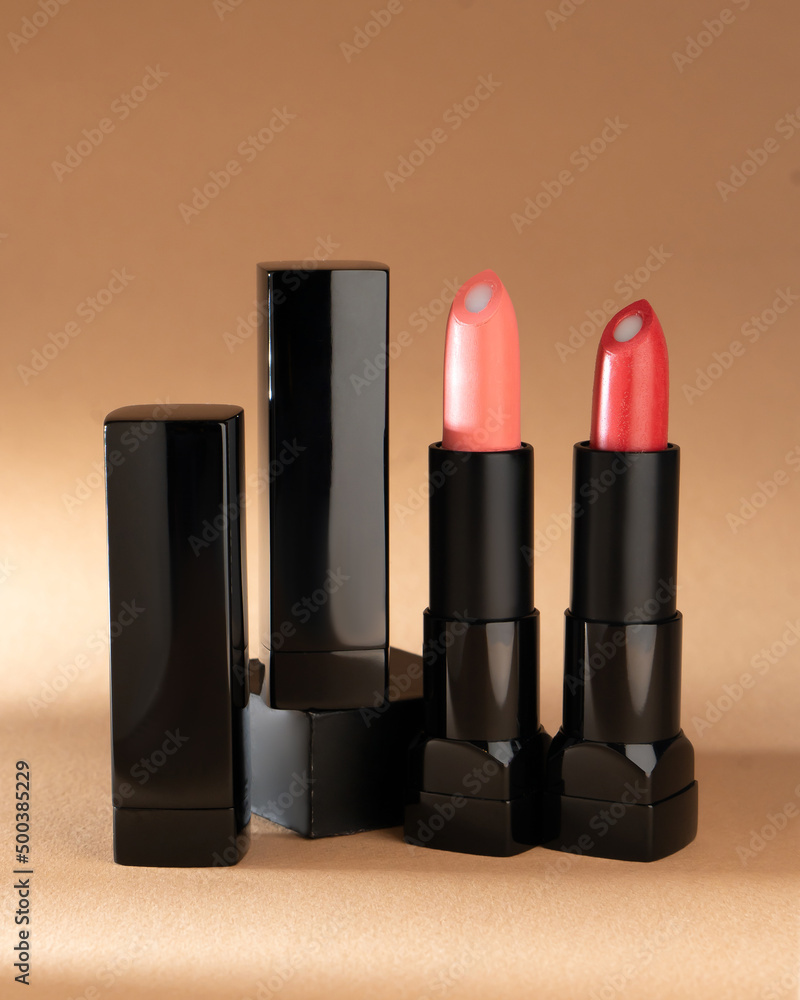 Obraz premium Palette of red lipsticks on nude background