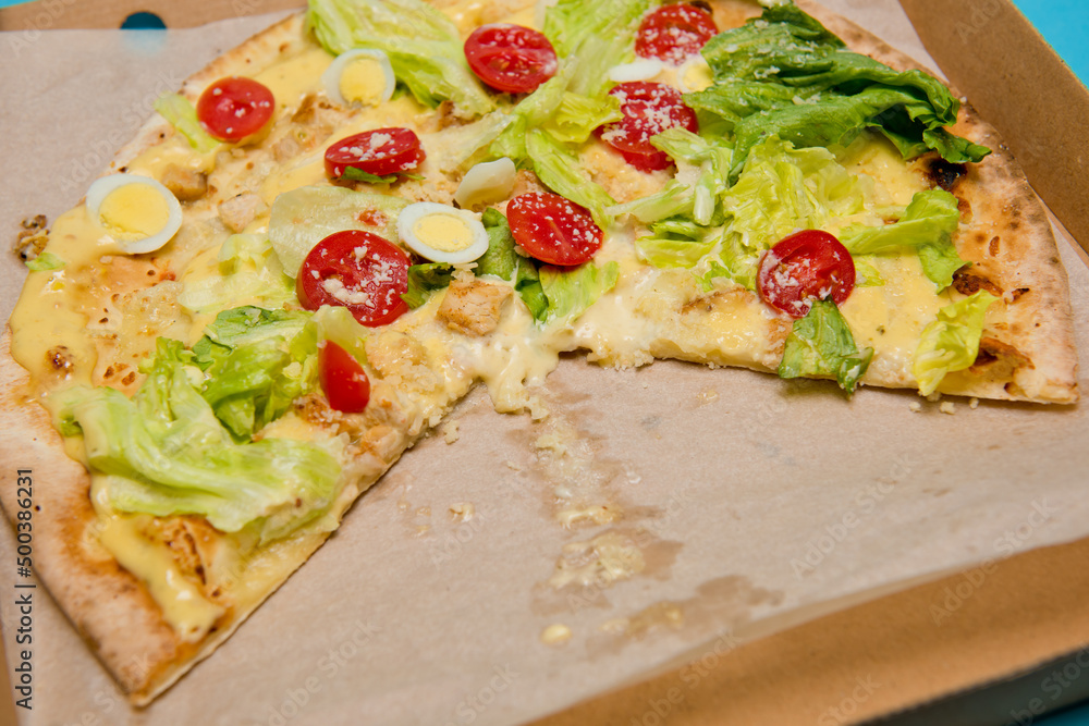 Delicious hot pizza in cardboard box. Selective focus.