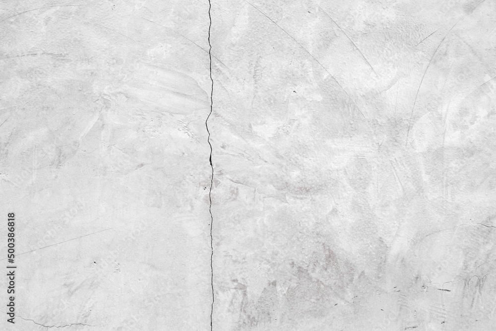 Naklejka premium gray blank cracked plaster wall background for creative design.